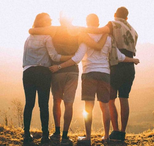 Group of young people looking at sunset