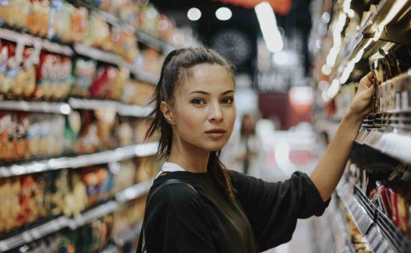 woman at supermarket looking at camera
